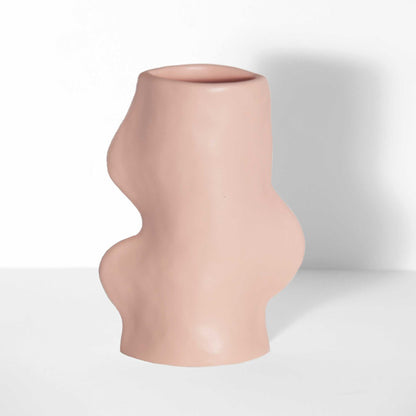 handmade ceramic vase in pink with flowing sculptural design