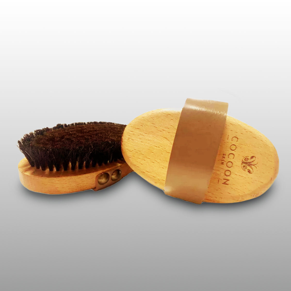 body brush with natural bristles and copper elements for dry brushing routine