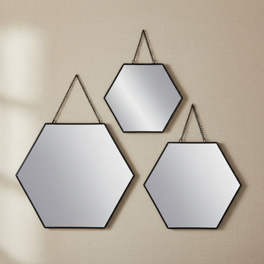 black hexagonal mirror set arranged on wall in living room