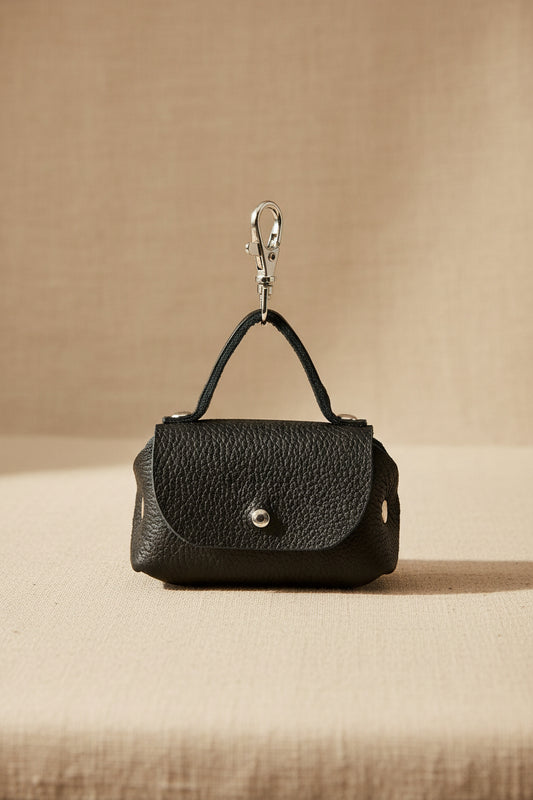 black dog waste bag dispenser with carabiner and metal ring opening