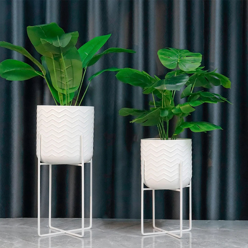 Set of two bright white metal planters with stands for indoor and outdoor use