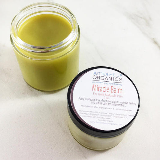 organic herbal balm in jar made with natural plant ingredients for body care