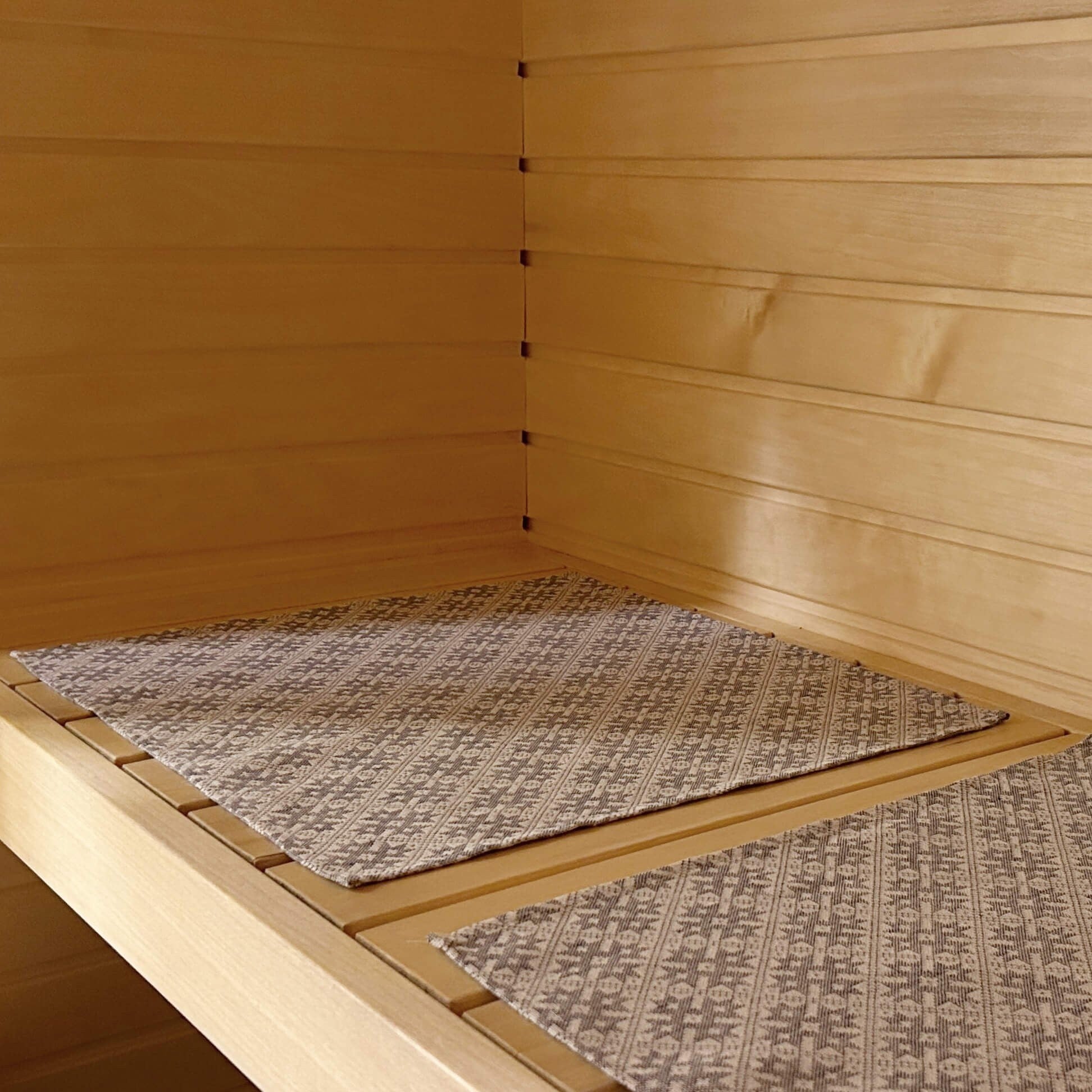 sauna seating pad with traditional pattern in linen and cotton blend