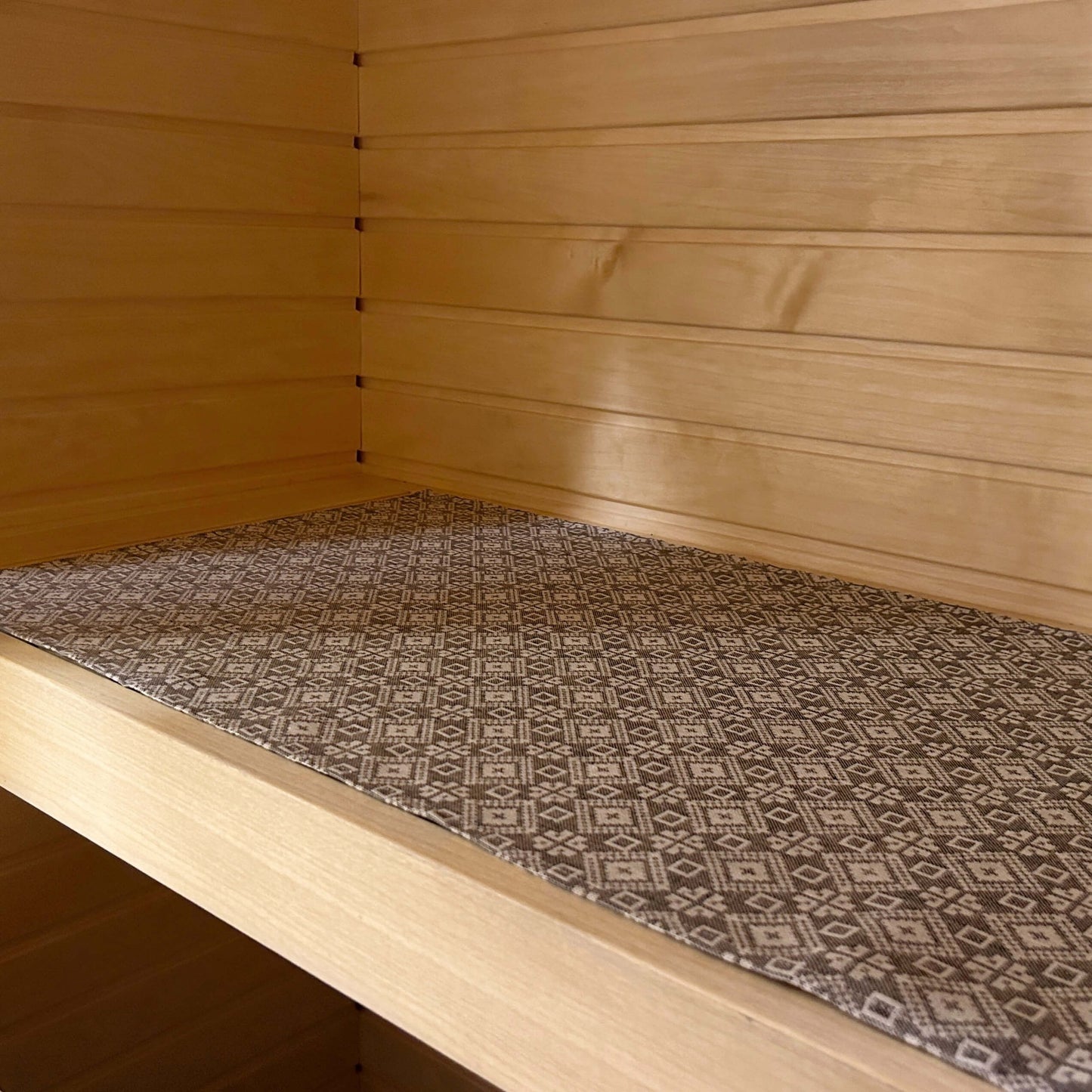 sauna seating pad with traditional pattern in linen and cotton blend