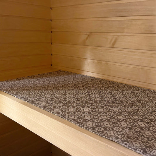 sauna seating pad with traditional pattern in linen and cotton blend