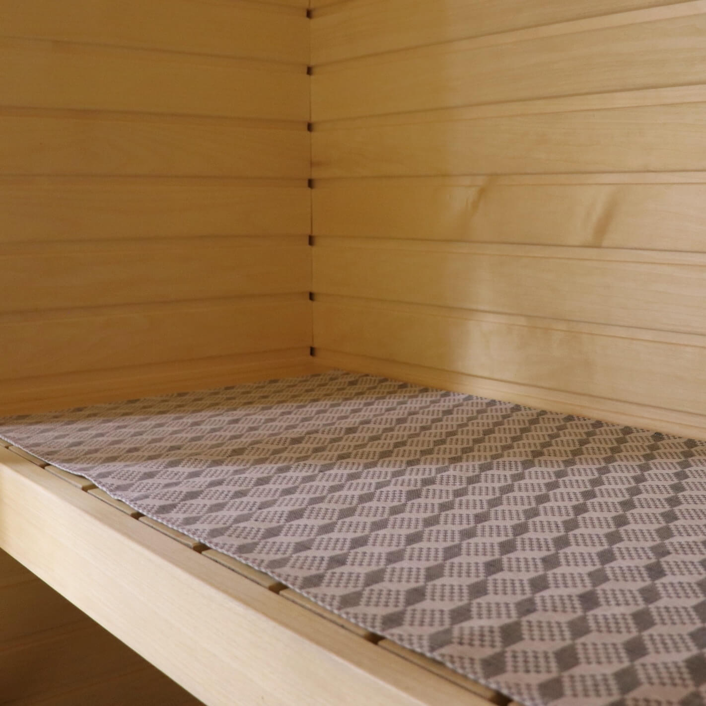 sauna seating pad with traditional pattern made from linen and cotton