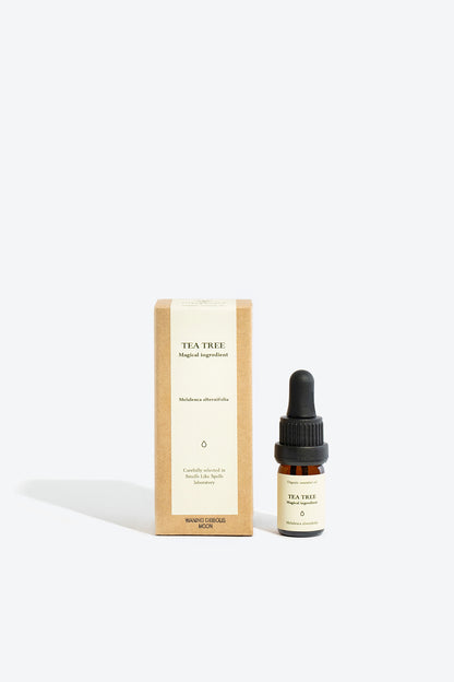 organic tea tree essential oil in glass bottle for aromatherapy and home use