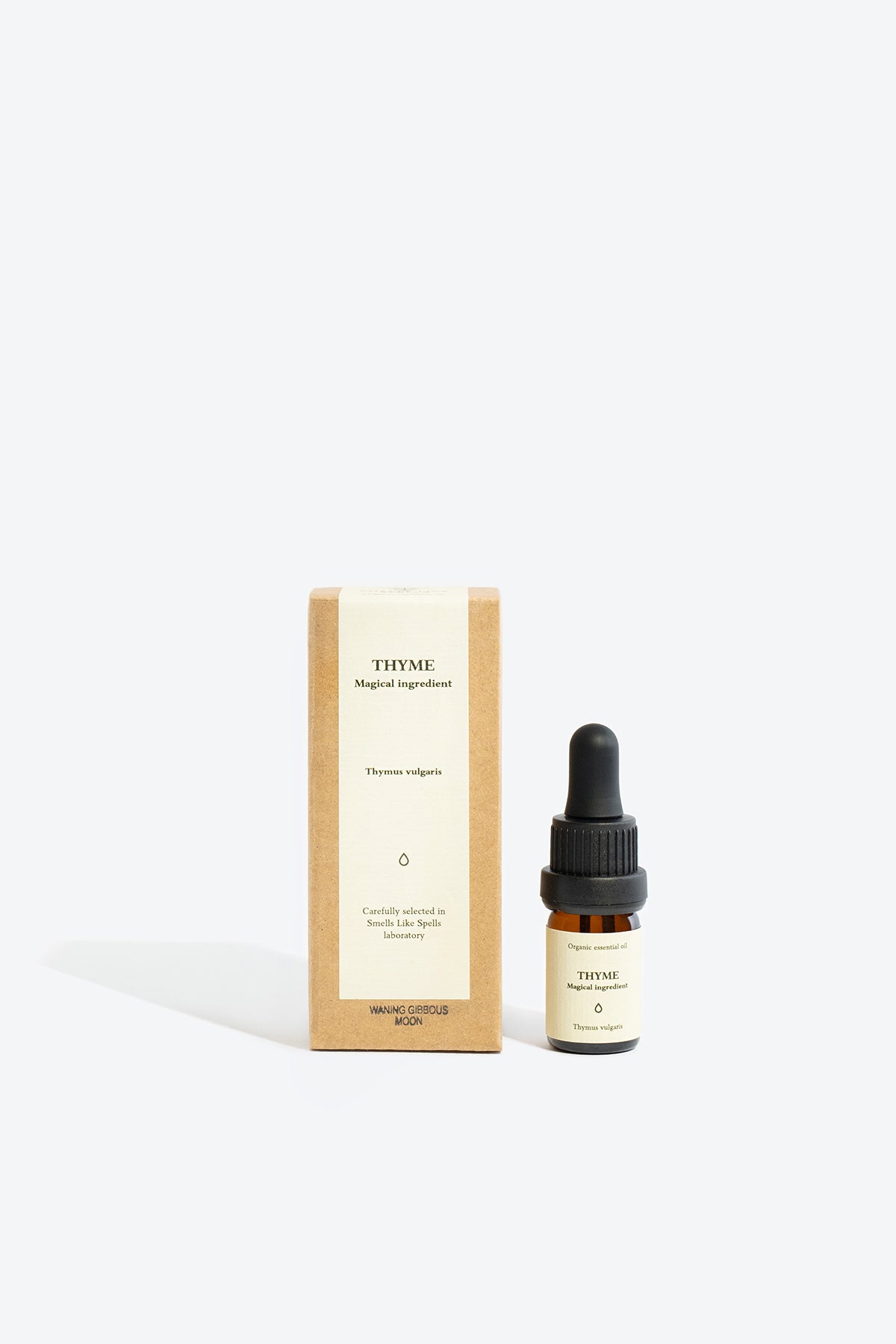 thyme essential oil in glass bottle for aromatherapy and natural indoor fragrance