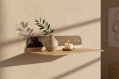 minimal metal wall shelf with rounded edges for plants and decor