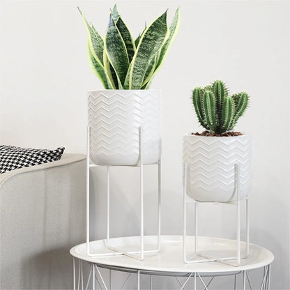 set of two white metal plant pots with stands for indoor and outdoor use