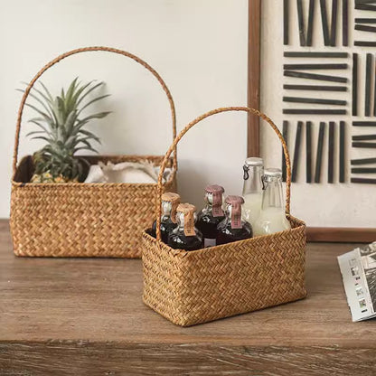 rectangular woven straw basket organizer with handles used for home storage